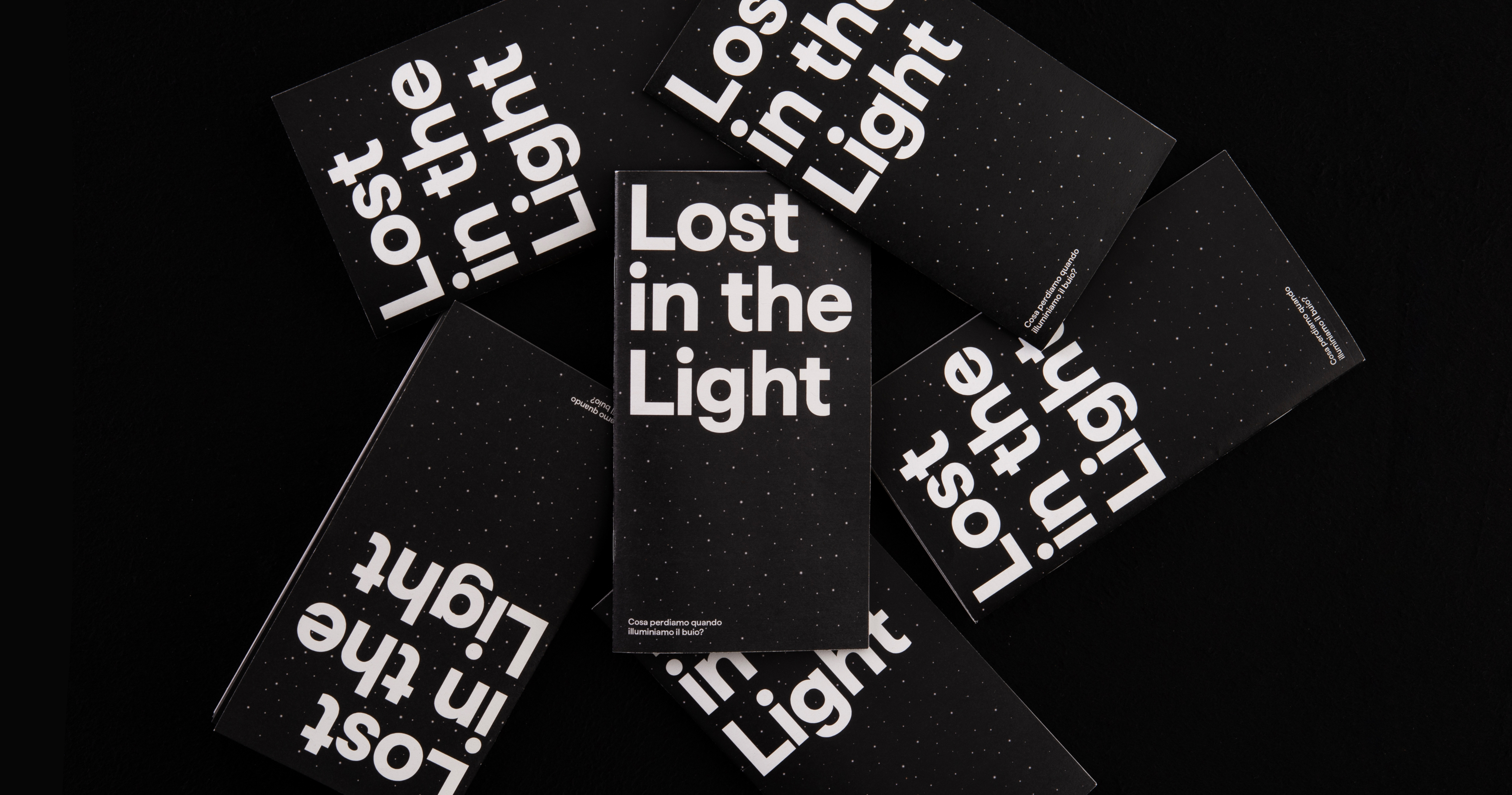 Black Lost in the Light publications with experimental white typography.